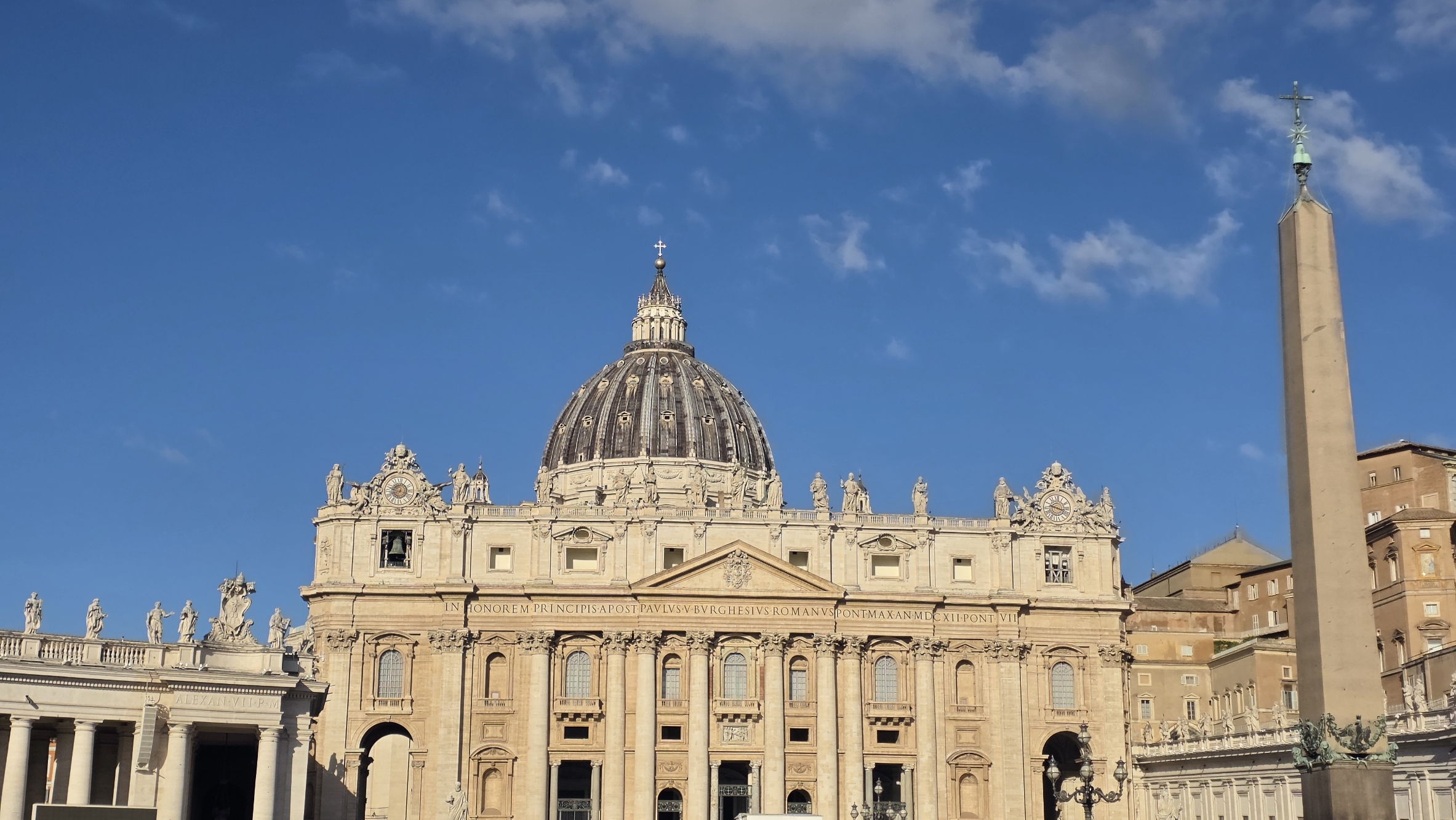 Saint Peter's Basilica and the obelisk under morning cloud